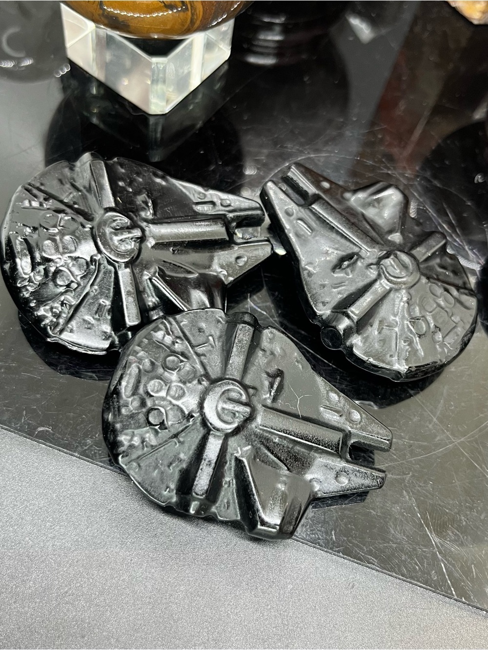 Black obsidian Millennium Falcon carving